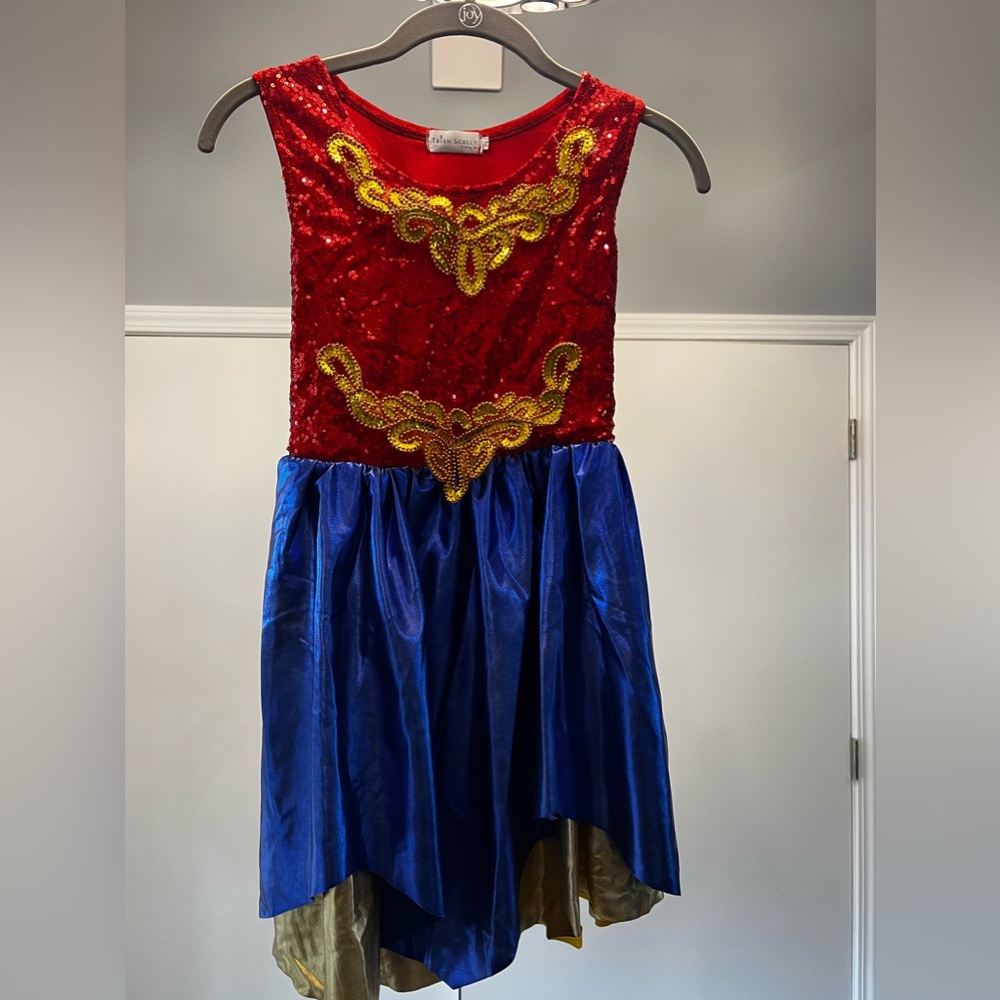 Little girl wonder women. Size 8 left shoulder does need appliqué repaired.